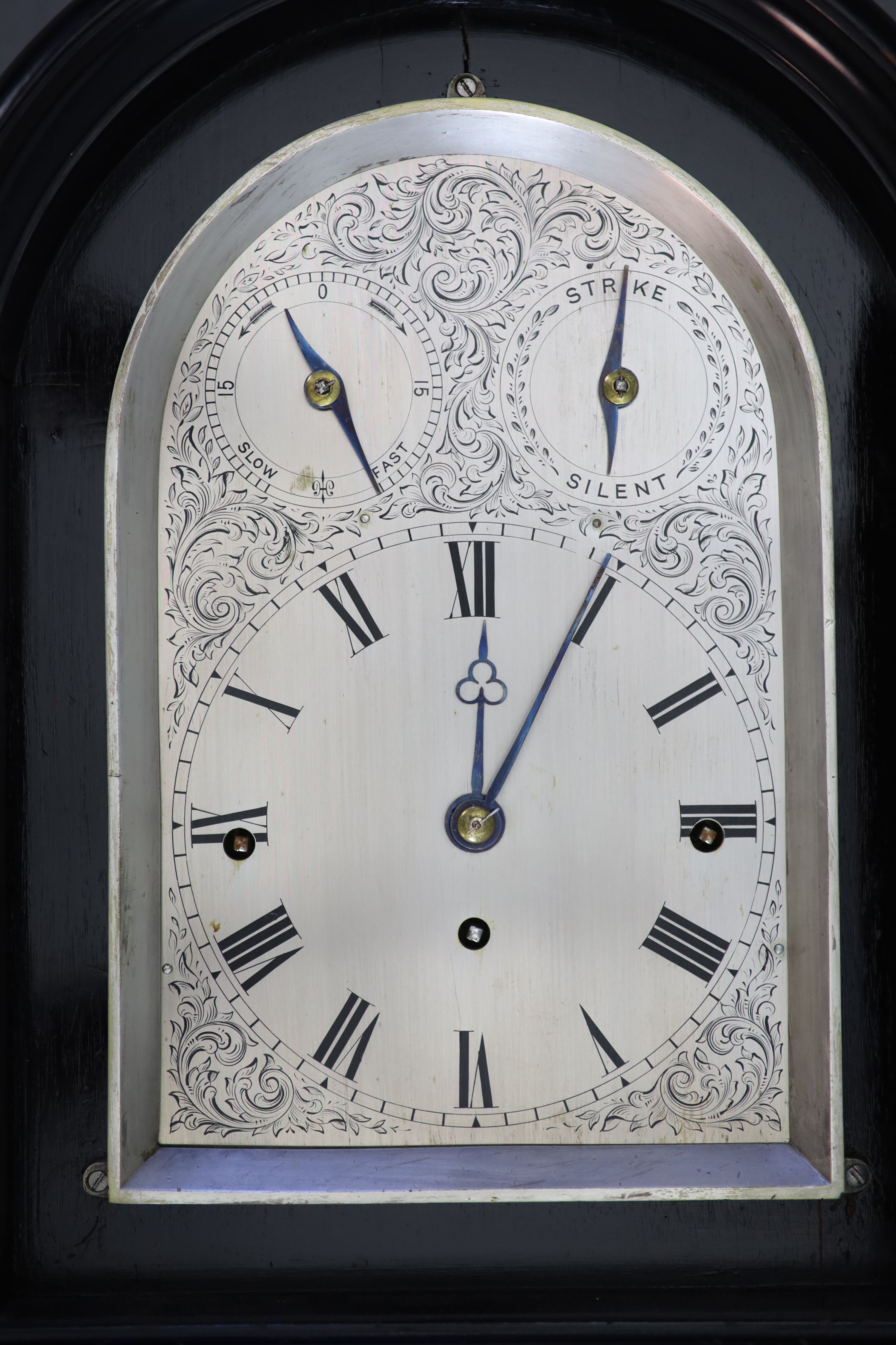 A large late Victorian ebonised bracket clock with bracket